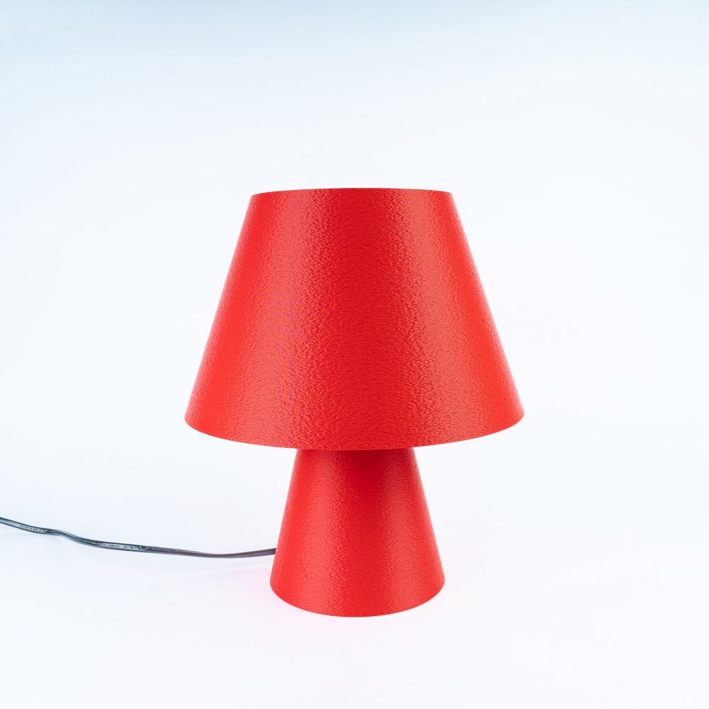 Lámpara Fome roja de CuatroCeroTres, diseño moderno con pantalla luminosa en color rojo, sobre superficie blanca.